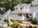 Charming two-story home with landscaped front yard and entrance stairway at 3811 Carnegie Ln, Raleigh, NC 27612
