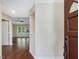 View of home foyer with wood floors and view to living room at 3811 Carnegie Ln, Raleigh, NC 27612