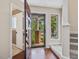 View of home foyer with wood floors and view to front porch at 3811 Carnegie Ln, Raleigh, NC 27612