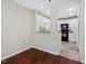 View of kitchen from dining area, featuring white cabinets and tile backsplash at 3811 Carnegie Ln, Raleigh, NC 27612