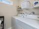 Well-lit laundry room featuring a washer, dryer, and shelving for storage at 3811 Carnegie Ln, Raleigh, NC 27612