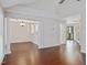 Spacious living room with hardwood floors, elegant columns, and ample natural light at 3811 Carnegie Ln, Raleigh, NC 27612