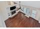 Open-concept living area with a fireplace, built-in shelving, and hardwood floors at 3811 Carnegie Ln, Raleigh, NC 27612
