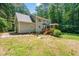 Spacious backyard featuring a deck and brick patio, perfect for outdoor entertaining at 3821 Whispering Branch Rd, Raleigh, NC 27613