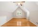Bedroom with hardwood floors and an angled ceiling at 3821 Whispering Branch Rd, Raleigh, NC 27613