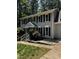 Attractive two-story home featuring a gray exterior, black shutters, and tidy landscaping at 3821 Whispering Branch Rd, Raleigh, NC 27613