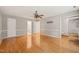 Spacious main bedroom showcasing hardwood floors, and a view into the bath and large walk-in closet at 3821 Whispering Branch Rd, Raleigh, NC 27613