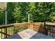 Outdoor patio with stone tiles, offering a cozy retreat with wooded views at 3821 Whispering Branch Rd, Raleigh, NC 27613