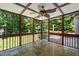 Relaxing screened porch with stone flooring, perfect for enjoying the outdoors in comfort at 3821 Whispering Branch Rd, Raleigh, NC 27613