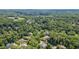 Beautiful aerial view of a lush, wooded neighborhood with well-maintained homes and landscaping at 401 Westbury Dr, Chapel Hill, NC 27516