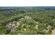 Aerial view showcasing community homes among mature trees, in a serene and picturesque setting at 401 Westbury Dr, Chapel Hill, NC 27516