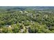 Overhead view of homes nestled in a vibrant, green landscape showing the community's layout at 401 Westbury Dr, Chapel Hill, NC 27516