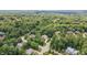 Aerial view revealing a neighborhood surrounded by lush greenery, showcasing the property's location and setting at 401 Westbury Dr, Chapel Hill, NC 27516