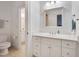 Bathroom featuring a white vanity with great storage and a large mirror at 401 Westbury Dr, Chapel Hill, NC 27516