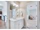 Bathroom with white cabinets and view to another room at 401 Westbury Dr, Chapel Hill, NC 27516