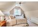 Finished bedroom with large windows providing bright light, neutral carpet, and a ceiling fan at 401 Westbury Dr, Chapel Hill, NC 27516