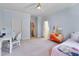 Light blue bedroom with neutral carpet and a ceiling fan at 401 Westbury Dr, Chapel Hill, NC 27516