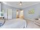Light blue bedroom with lots of natural light and two entry doors at 401 Westbury Dr, Chapel Hill, NC 27516