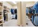 Spacious walk-in closet with custom shelving and racks for organized storage at 401 Westbury Dr, Chapel Hill, NC 27516