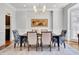 Elegant dining room with a large table, stylish chairs, and sophisticated decor at 401 Westbury Dr, Chapel Hill, NC 27516