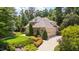 Beautifully landscaped home exterior with a spacious driveway and well-maintained lawn at 401 Westbury Dr, Chapel Hill, NC 27516