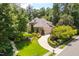 Stunning brick home featuring a manicured lawn, beautiful landscaping, and an attached two-car garage at 401 Westbury Dr, Chapel Hill, NC 27516