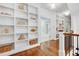 Upstairs hallway showcasing built-in shelving and gleaming hardwood floors at 401 Westbury Dr, Chapel Hill, NC 27516