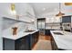 Open kitchen with stainless steel appliances, marble countertops, and a gas range at 401 Westbury Dr, Chapel Hill, NC 27516
