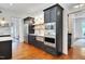 Kitchen area with stainless steel appliances, built-in microwave and oven, and hardwood floors at 401 Westbury Dr, Chapel Hill, NC 27516