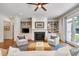 The living room showcases custom built-ins flanking a fireplace, offering ample storage and focal point at 401 Westbury Dr, Chapel Hill, NC 27516