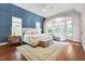 Spacious main bedroom with bay window, sitting area, and hardwood floors at 401 Westbury Dr, Chapel Hill, NC 27516