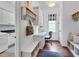 Bright mudroom with built-in bench, storage, and desk area at 401 Westbury Dr, Chapel Hill, NC 27516