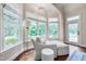 Bright sitting area featuring a plush chaise lounge and large windows at 401 Westbury Dr, Chapel Hill, NC 27516