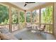 Inviting sunroom with natural light, comfortable seating and views of lush greenery at 401 Westbury Dr, Chapel Hill, NC 27516