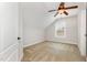 This bedroom has carpet flooring, a ceiling fan, a closet, a door, and a window with a view at 410 Stranraer Ct, Fuquay Varina, NC 27526