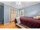 Cozy bedroom featuring a comfortable bed, a ceiling fan, and natural light from the window at 410 W Tenth St, Siler City, NC 27344