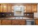 Kitchen with stainless steel sink and granite countertops at 410 W Tenth St, Siler City, NC 27344