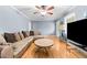 Cozy living room with hardwood floors, natural light, and comfortable seating at 410 W Tenth St, Siler City, NC 27344