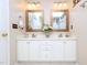 Clean and well-maintained bathroom featuring a double vanity with ample storage space at 412 Onondaga Ct, Holly Springs, NC 27540