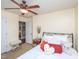 Cozy bedroom featuring a bed with decorative pillows, a bench, and a serene ambiance at 412 Onondaga Ct, Holly Springs, NC 27540