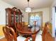 Elegant dining room with classic hutch and seating for six at 412 Onondaga Ct, Holly Springs, NC 27540