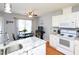 Open kitchen design with a breakfast nook area featuring a table, chairs, and a large window at 412 Onondaga Ct, Holly Springs, NC 27540