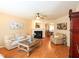 Cozy living room with hardwood floors, fireplace, and ample seating, ideal for relaxation at 412 Onondaga Ct, Holly Springs, NC 27540
