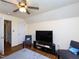 Finished room with seating and television offering a cozy space for entertainment and relaxation at 412 Onondaga Ct, Holly Springs, NC 27540