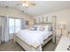 Comfortable main bedroom featuring a king bed, bright window and neutral decor at 412 Onondaga Ct, Holly Springs, NC 27540