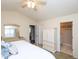 Inviting bedroom featuring a bright window, an armoire, and a relaxing ensuite bathroom at 412 Onondaga Ct, Holly Springs, NC 27540