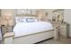 Comfortable main bedroom featuring a king bed, dresser and neutral decor at 412 Onondaga Ct, Holly Springs, NC 27540