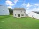 Expansive backyard with lush green grass, perfect for outdoor activities and relaxation at 425 Sunny Field Dr., Wake Forest, NC 27587