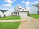 Charming two-story home with a well-manicured lawn and a two-car garage at 425 Sunny Field Dr., Wake Forest, NC 27587
