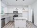 Well-lit kitchen with stainless appliances, light grey cabinets, a center island, and modern finishes at 425 Sunny Field Dr., Wake Forest, NC 27587